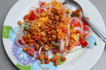 Chola Chana Chaat, plate of Chickpeas curry or Chola masala. Ramadan Iftari Dinner. Ramzan Meal. Specially for Eid, Diwali or Christmas. Top Refreshment for Roza Iftar. Famous Indian street food