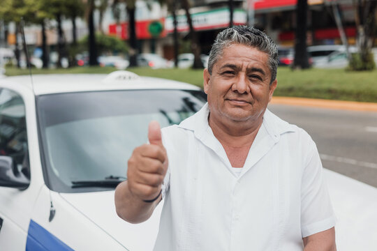 Latin Taxi Driver Senior Man With Car On Background At City Street In Mexico In Latin America, Hispanic Adult People