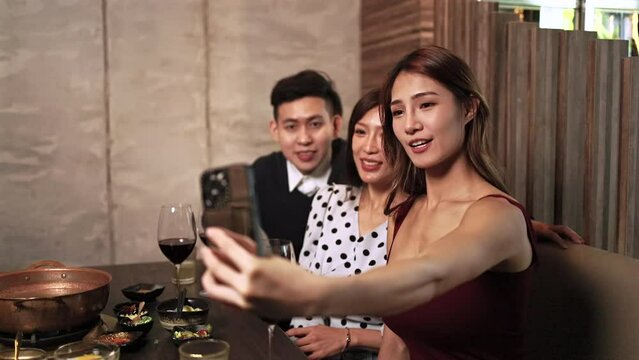 Group Of Friends Taking Selfie During Lunch at restaurant