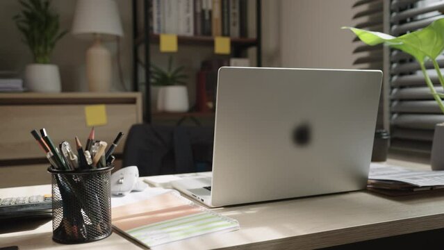 Setup home office for work of place hot of laptop and copybooks on desk in modern office with no people