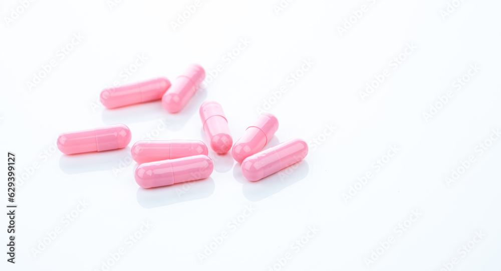 Poster pink capsule pills on white background. pharmaceutical industry. vitamins, minerals, and supplements