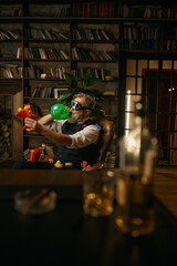 Selective focus of rich elegant senior businessman playing toys