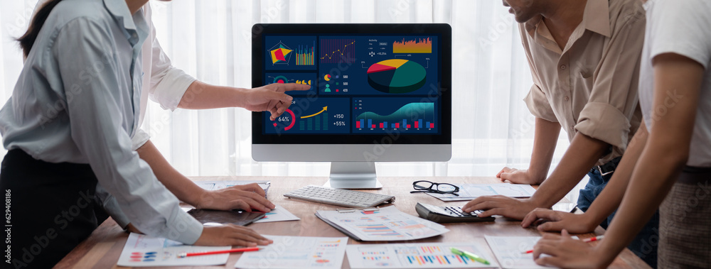 Leinwandbilder analyst team utilizing bi fintech to analyze and pointing at financial dashboard paper office. busin