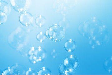 Beautiful Transparent Shiny Blue Soap Bubbles Floating in The Air. Abstract Background, Blue Textured, Celebration Festive Backdrop, Refreshing of Soap Suds, Bubbles Water.