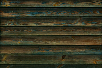 weathered wooden planks with paint flakes