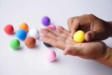 Close up hands sculpt plasticine into round shapes. Concept, alzheimer, weak muscle patients recovering activity by sculpting. Make concentration for ADHD or autistic symptom kids. Enhance imagination