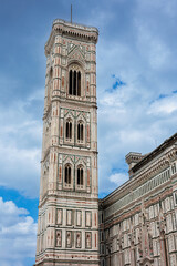 Fototapeta na wymiar Giotto's Campanile, the Bell Tower of Santa Maria del Fiore, the cathedral of Florence in Piazza del Duomo, Florence - Italy