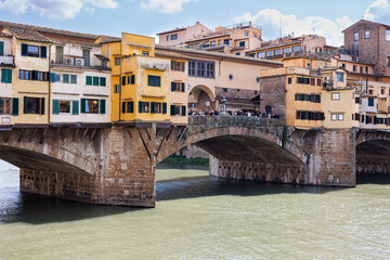 Fototapeta na wymiar View of the crowded Ponte Vecchio on a Beautiful Sunny Spring Day in Florence, Italy
