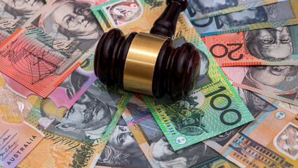 Judge's gavel on australian dollars, justice concept