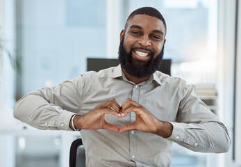 Portrait, business and black man with heart sign, support or care with icon at work, happiness or...
