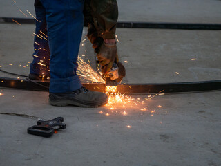 Welding work in the construction site. Sparks from welding