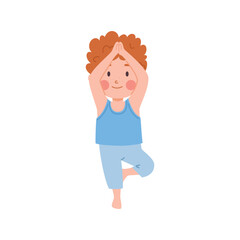 Cute ginger boy standing in yoga pose on one leg, hands on top, happy little kid doing yoga exercise vector illustration