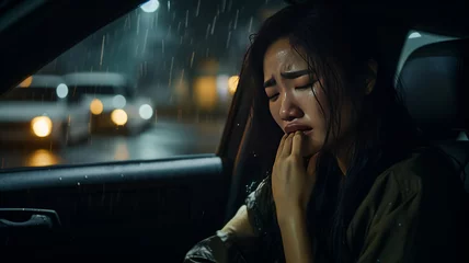Foto op Plexiglas photograph of Asian woman is alone in car at the night. She is stressed and crying generative ai © JKLoma