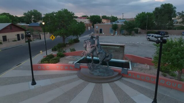 Old Town Albuquerque sign at entrance. Albuquerque, New Mexico history. Aerial shot at dawn.