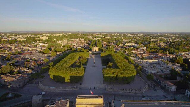 The drone aerial footage of The Porte du Peyrou, Promenade du Peyrou garden and ancient water tower at sunrise, Montpellier, France. 