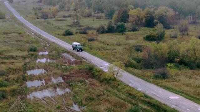 Military car Truck moving on the road. Ukraine Bakhmut Aerial shot