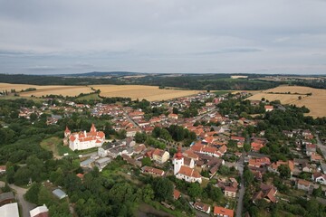 Fototapeta na wymiar Cervena Recice castle and town with old city square aerial panorama view, czech cityscape,vysocina Region,Czechia,Europe