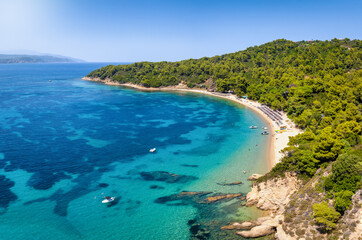 Aerial view of the beautiful beach at Agia Eleni, Skiathos island, Greece, with emerald sea and fine sand