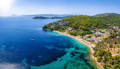 Aerial view of the beautiful coast of Skiathos island, Sporades, Greece, with the beach of Troulos and the bay of Koukounaries