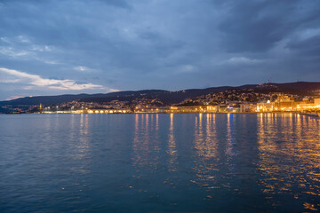dusk light on cityscape west of Bersaglieri pier, Trieste, Friuli, Italy