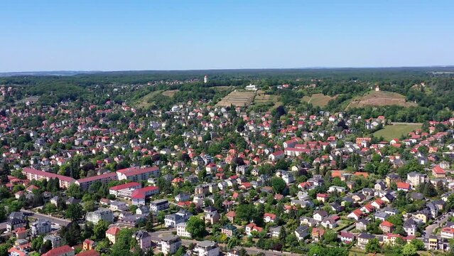 Drone video, flight over the fields and houses to the vineyards and the Spitzhaus, old historic Bismarck Tower, Radebeul, Saxony, Germany, Europe