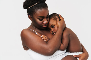 Black young woman hugging and holding her son