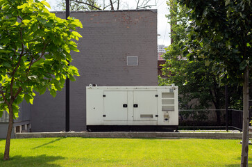 auxiliary diesel generator for emergency power supply. Industrial generator connected to the...
