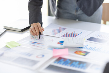 Businessman working at office with documents on his desk, doing planning analyzing the financial report, business plan investment, finance analysis concept	