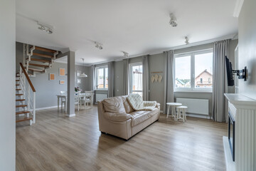 White, modern open space with wooden furniture set