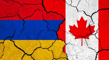 Flags of Armenia and Canada on cracked surface - politics, relationship concept
