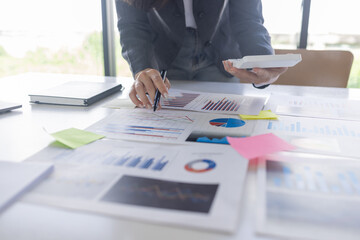 Businessman working at office with documents on his desk, doing planning analyzing the financial report, business plan investment, finance analysis concept	