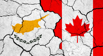 Flags of Cyprus and Canada on cracked surface - politics, relationship concept