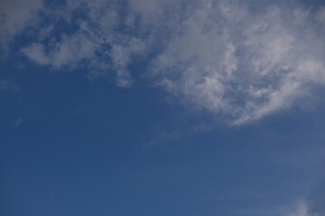 White clouds against the blue sky
background summer cloudy sky, soft light blue white sky background