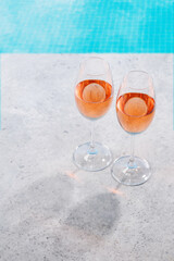 Refreshing rose wine by the pool on a sunny day