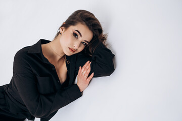 Close up fashion portrait of young pretty indian latin american woman posing in photo studio on...