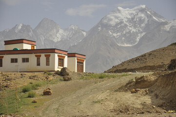 Beautiful view of a Ladakhi house with glacier view in the background in Padum, Zanskar Valley, Ladakh, INDIA.