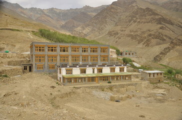 A tibetan Buddhist school with rock mountains in the background in Padum, Zanskar Valley, Ladakh, INDIA. 