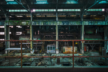 mechanical engines and control panel in an abandoned factory