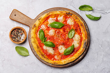 Margarita pizza with tomatoes, mozzarella cheese and basil