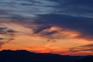 Fototapeta na wymiar Sunset in the mountains, beautiful clouds.