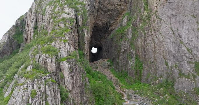Drone reveal large mysterious eroded hole through Torghatten mountain