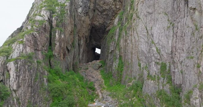 Drone reveal opening of old eroded hole through Torghatten mountain