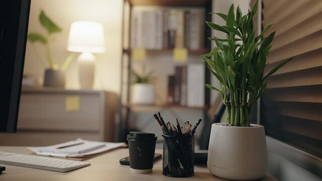 close-up of Asian Businessman working checking and searching Documents data contract with laptop computer in the late night, online education, studying concept,Online internet marketing, freelance, wo