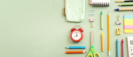 Back to school concept on pastel green background. Top view