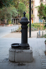 Water source on the street of the city. Summer, heat, thirst. Climate change, planet warming.