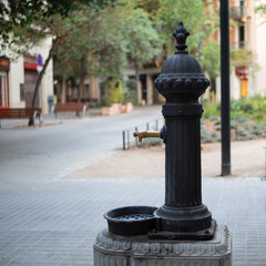 Water source on the street of the city. Summer, heat, thirst. Climate change, planet warming.