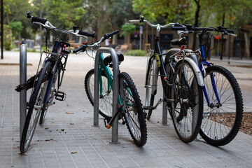 Bicycles parked on a city street. Healthy lifestyle. Caring for the environment.