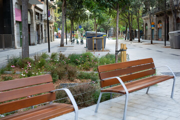 Recreation area, benches, tables on a green street in a modern city. Freedom from transport.