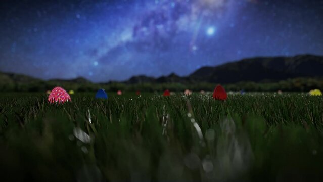 Colorful Easter eggs scattered on a green meadow against starry sky
