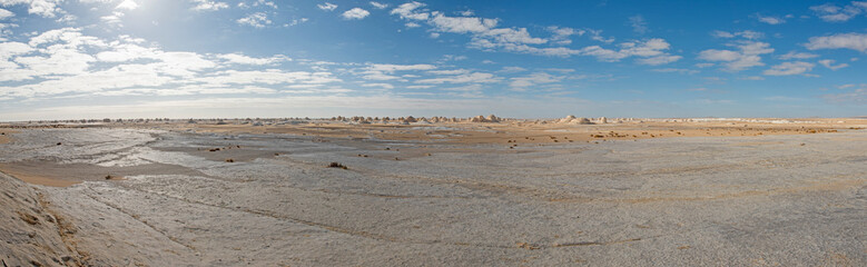 Barren desert landscape in hot climate with rock formation